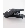 Protection Nike Quick Release noire positionnee ouverte sur une mentonniere, illustrant la facilité d'installation.